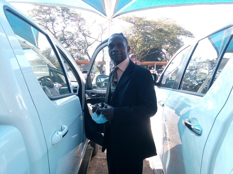 Assistant to the Vice Chancellor Mr Chihombori admires his new vehicle.