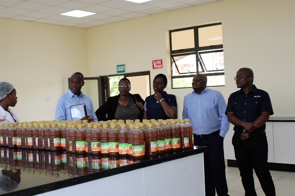 Mr. Nyazema (second from left) and his delegation gets an appreciation of the masawu drink which is manufactured at the BUSE Innovation Hub