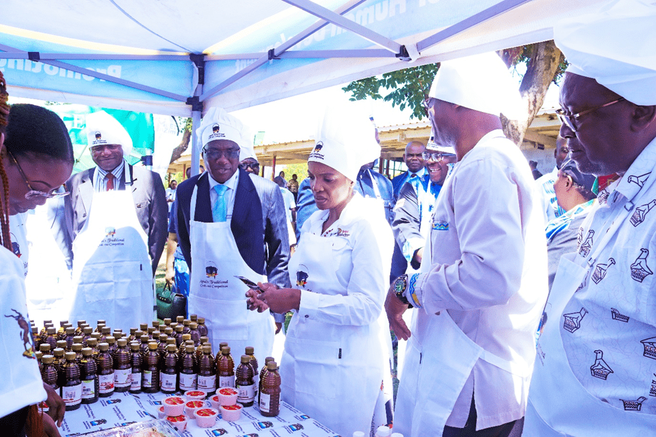 Hon. Barbara Rwodzi, flanked by Hon. Prof dr Amon Murwira and Vice Chancellor Prof. Eddie Mwenje, touring the BUSE stand at the Mashonaland Central Provincial Traditional Cookoff competition .